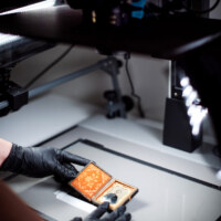 Digital camera processing old photo with tech